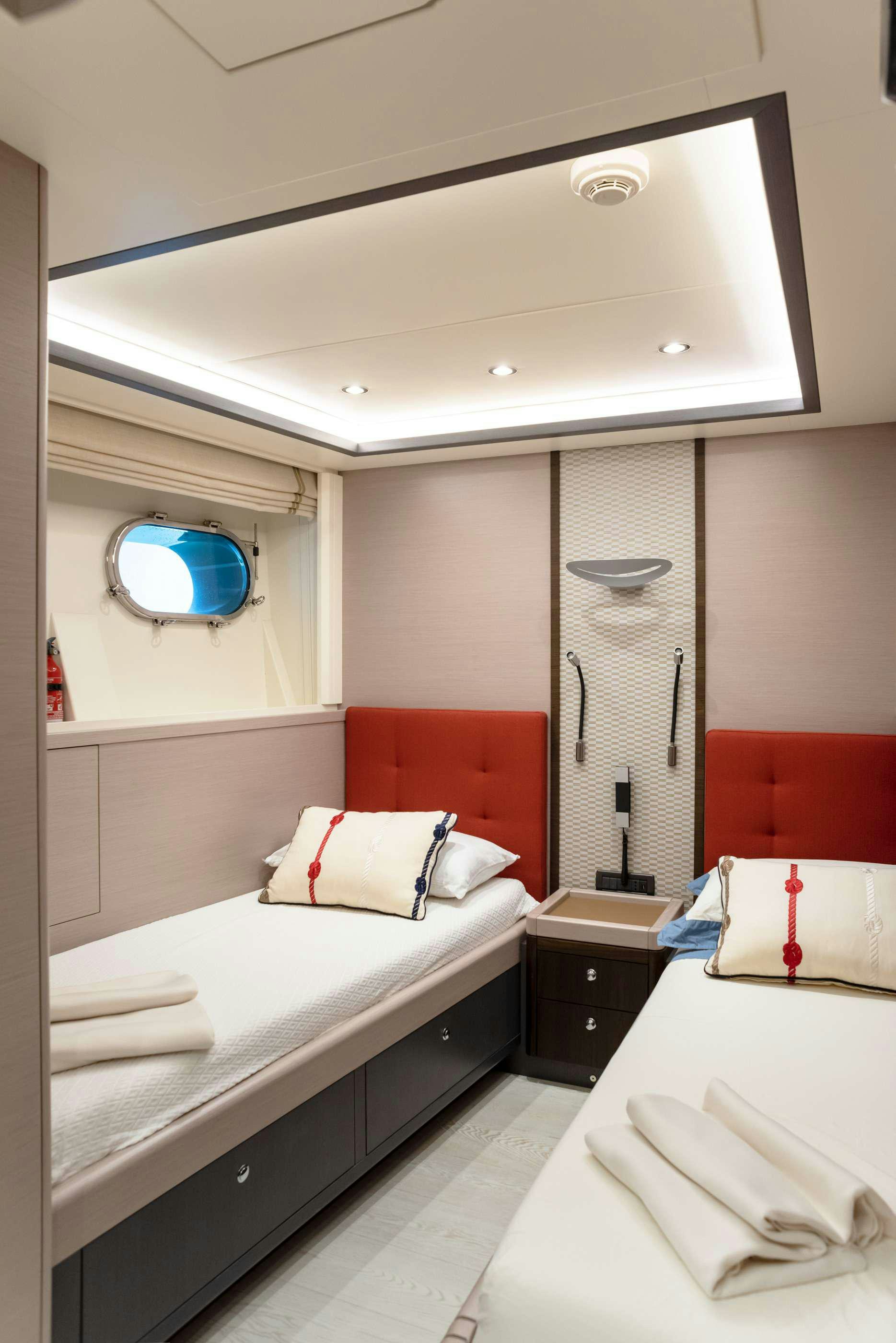 a hotel room with a mirror aboard GRANIL Yacht for Charter