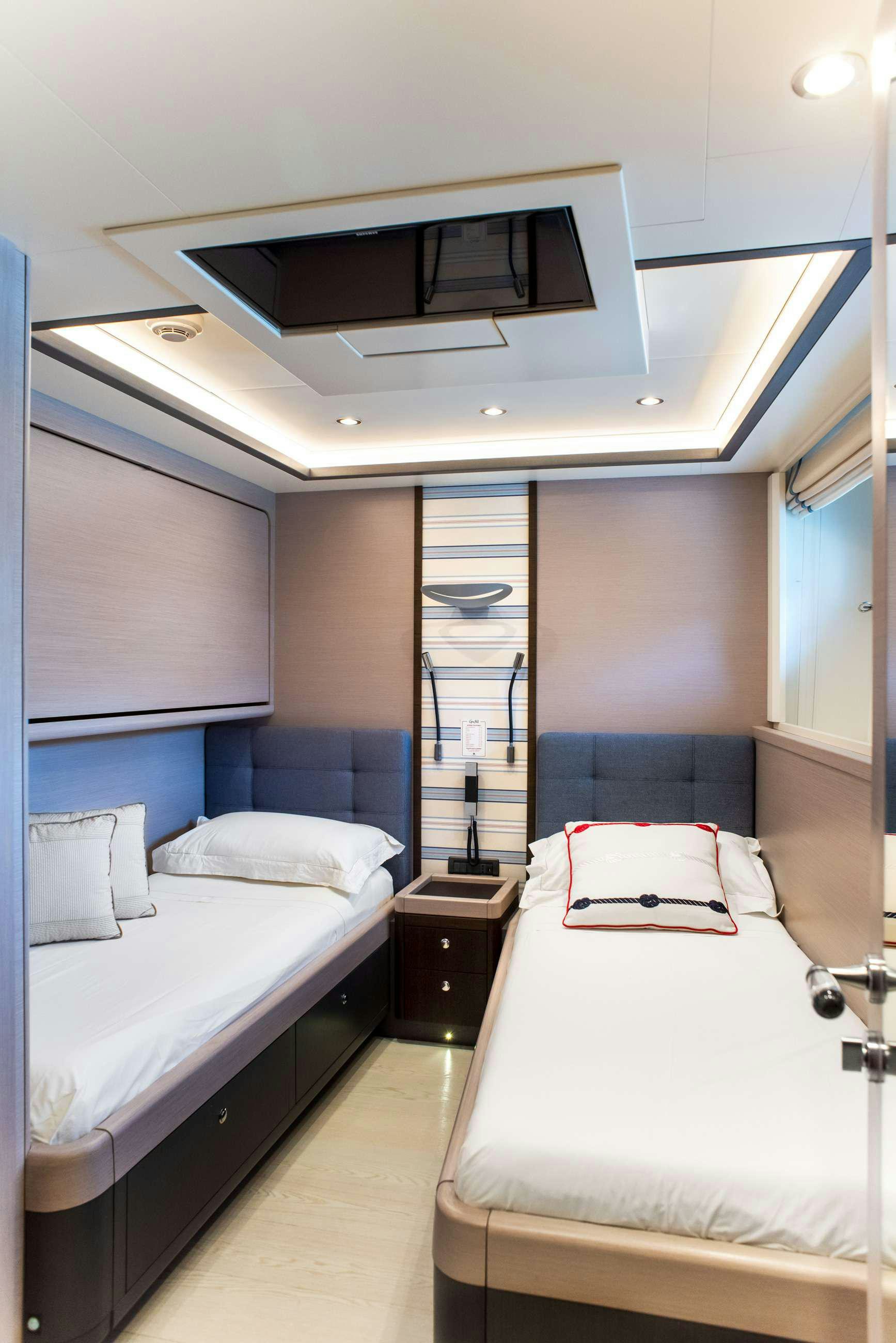a room with two beds aboard GRANIL Yacht for Charter