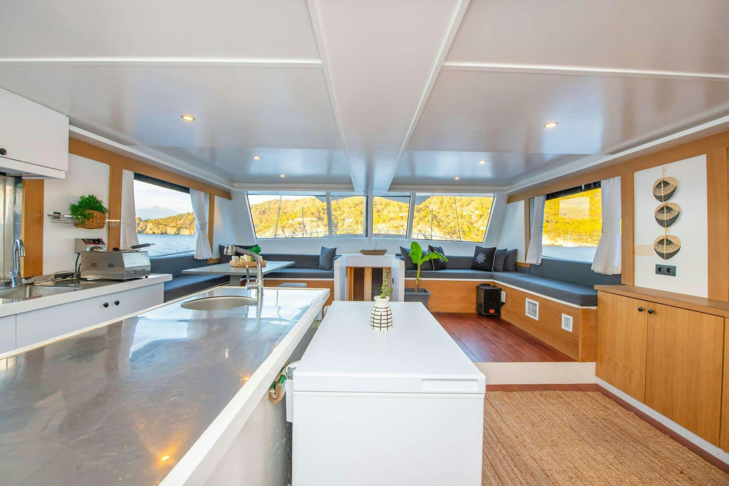 a large kitchen with a large island aboard NAYK 2 Yacht for Charter