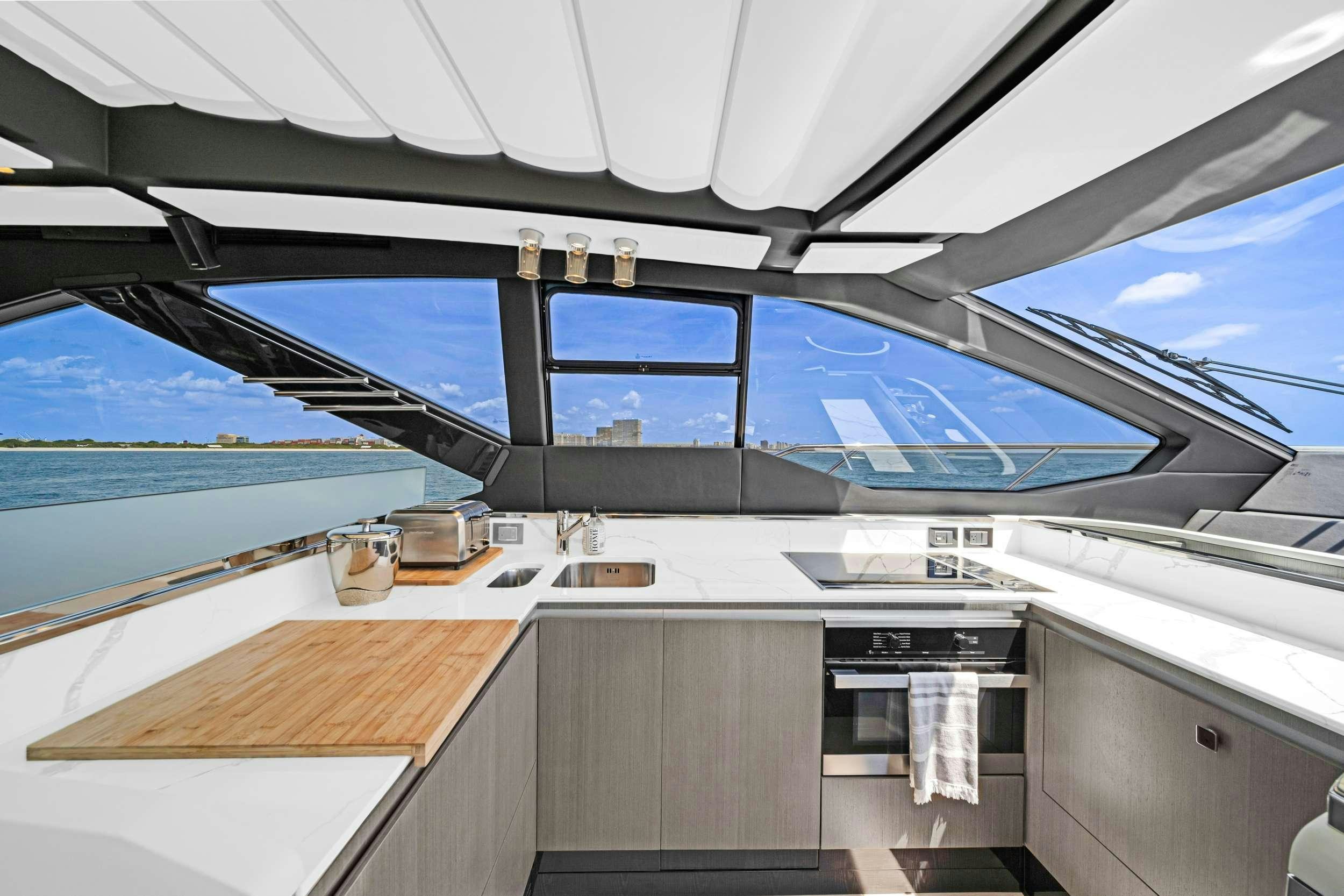 a large open space with a large window and a view of the ocean aboard ANOTHER CHANCE II Yacht for Charter