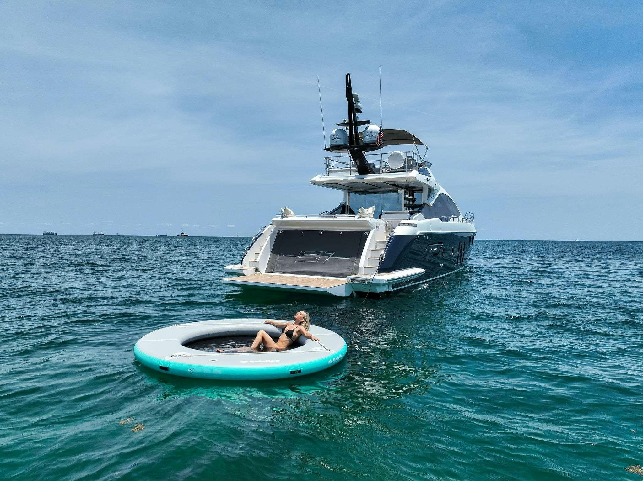 a man and a woman in a small boat in the water aboard ANOTHER CHANCE II Yacht for Charter