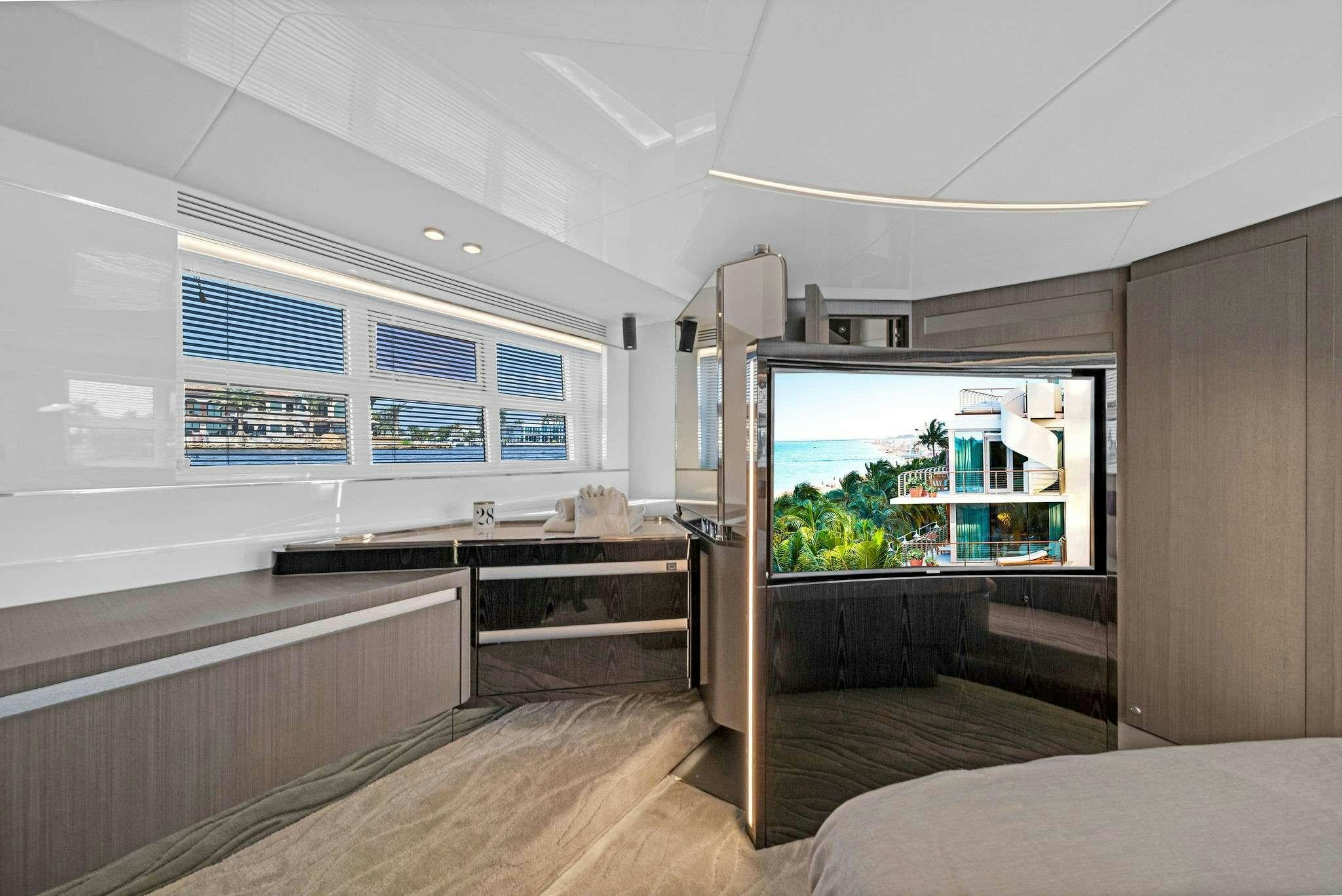 a room with a bed and a desk aboard ANOTHER CHANCE II Yacht for Charter