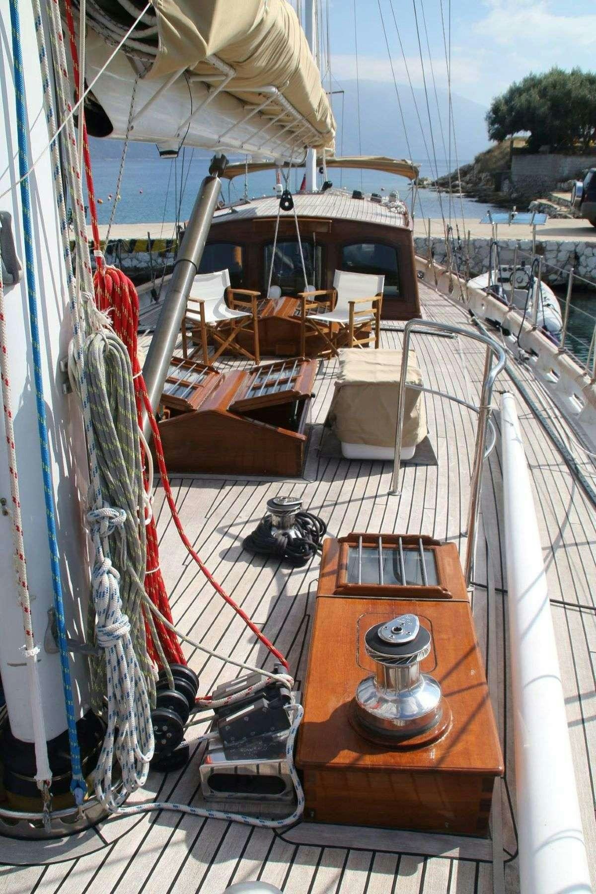 a boat with a steering wheel aboard WINDWEAVER OF PENNINGTON Yacht for Charter
