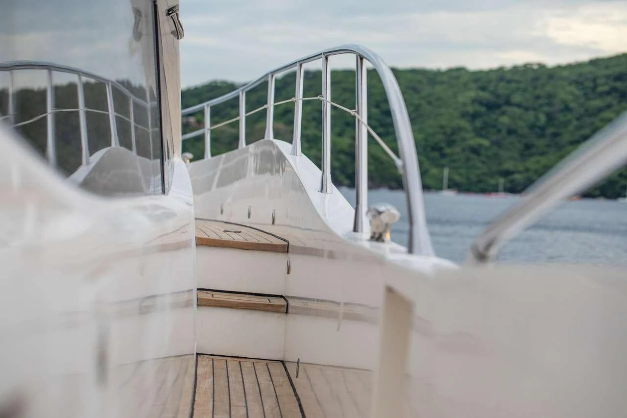 a white boat with a white canopy aboard COSTASOL Yacht for Charter