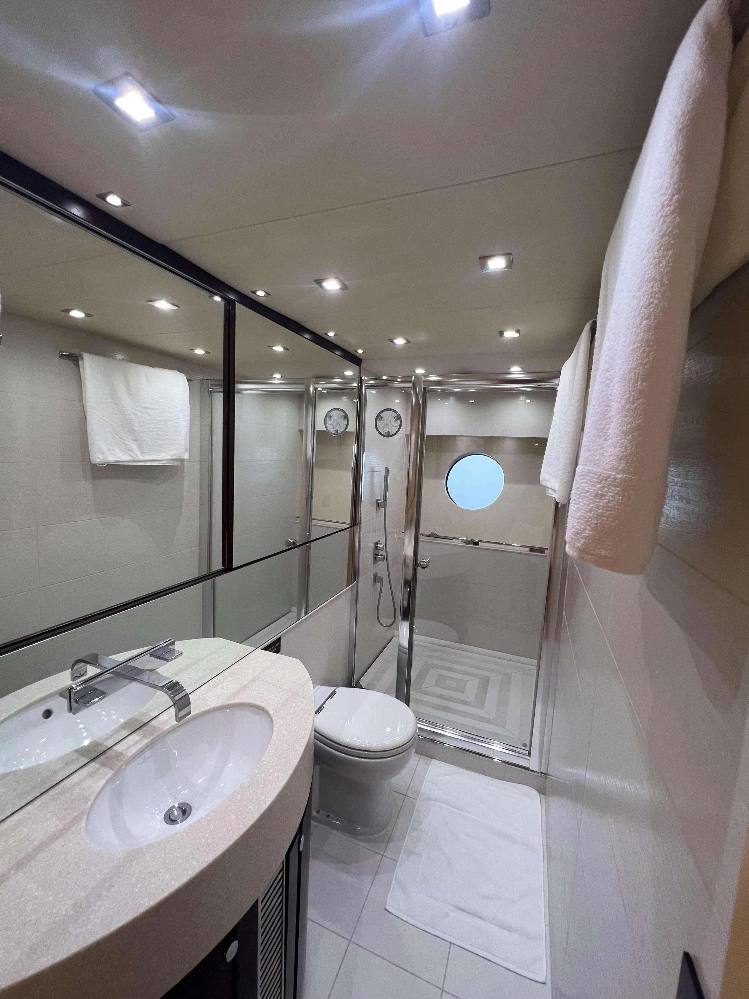 a bathroom with a large mirror aboard COSTASOL Yacht for Charter