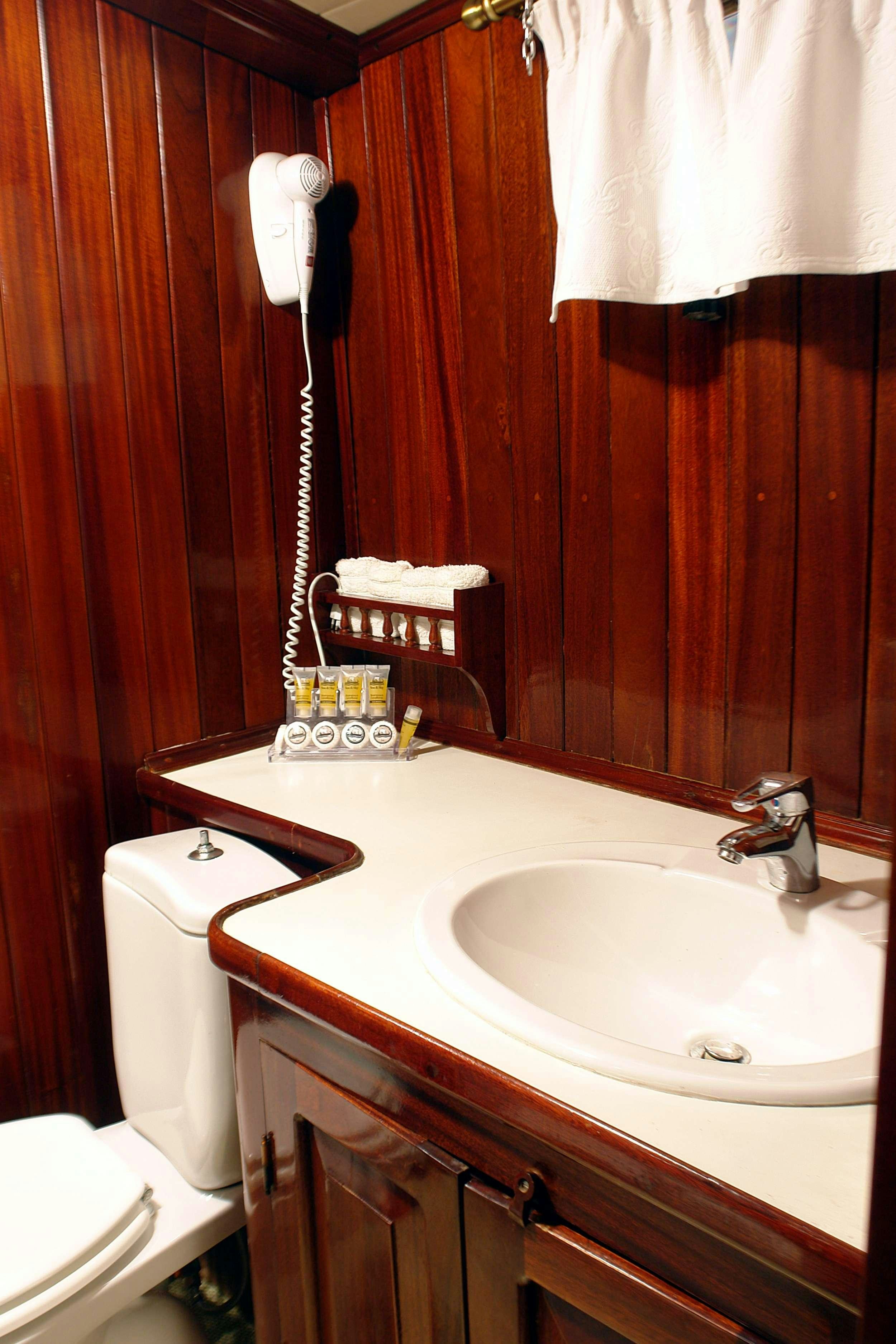 a bathroom with a sink and a toilet aboard ERATO Yacht for Charter