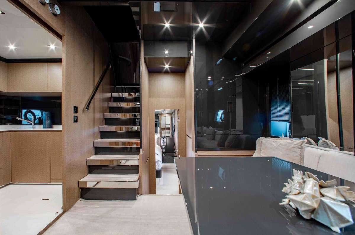 a room with a staircase and a couch aboard 2QUICK Yacht for Charter