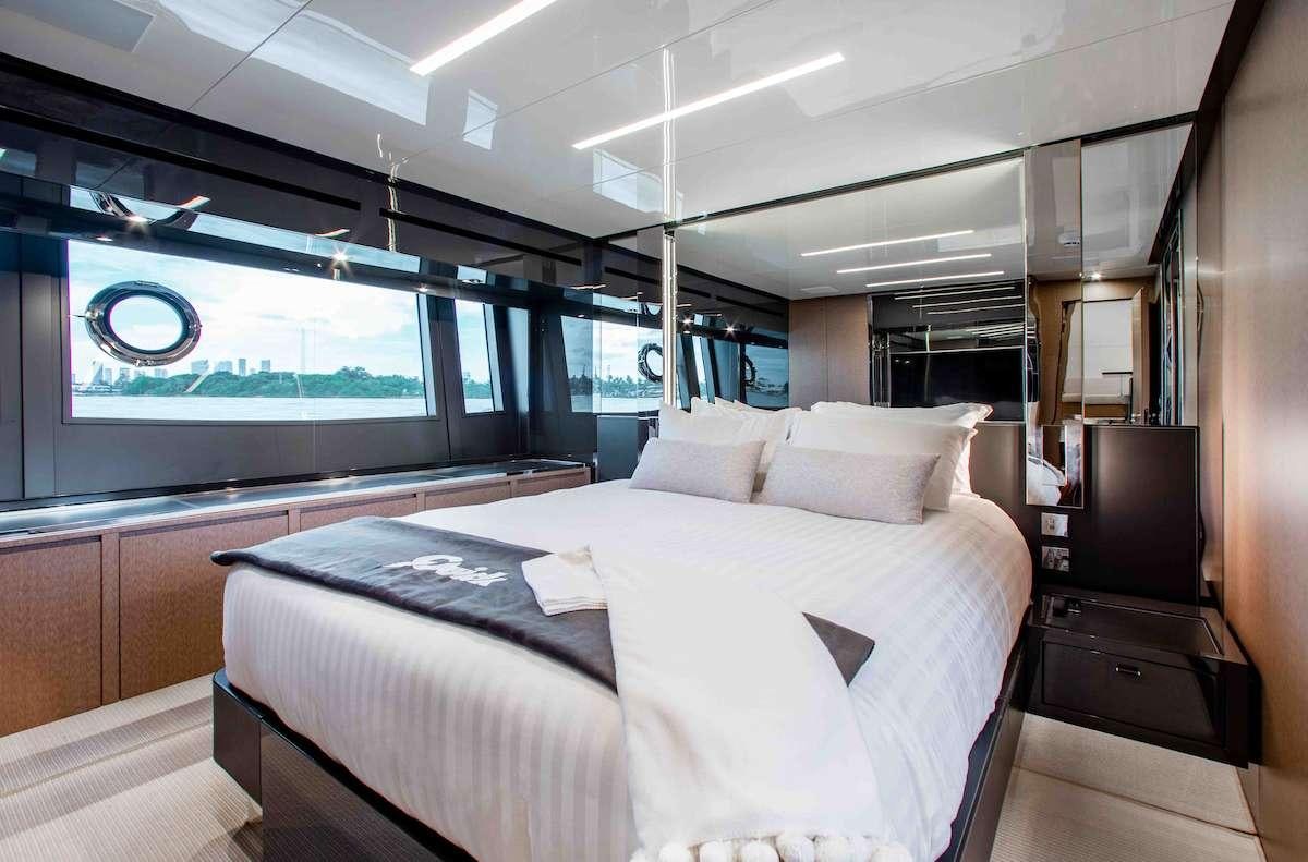 a room with a bed and a tv aboard 2QUICK Yacht for Charter