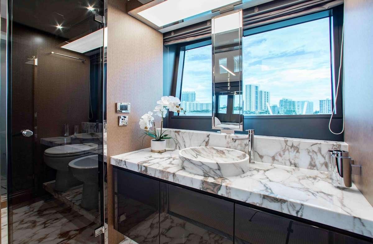 a bathroom with a large window aboard 2QUICK Yacht for Charter