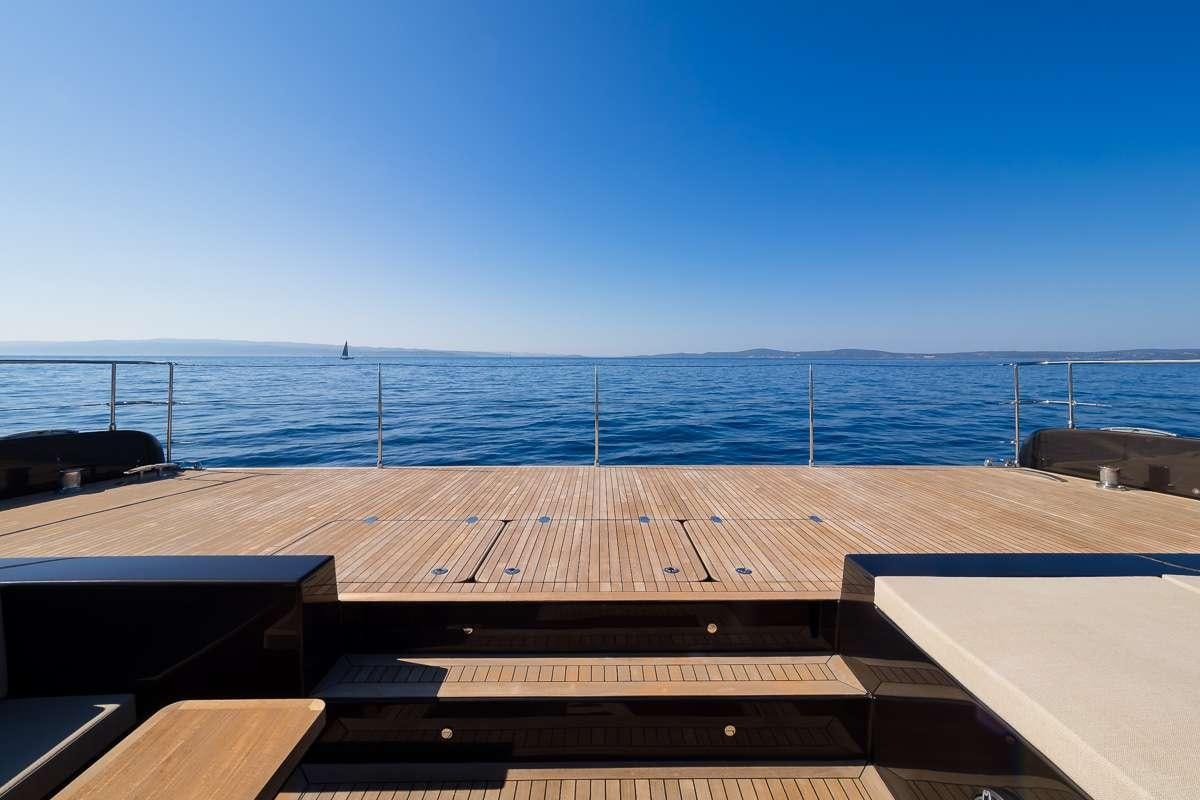 a deck overlooking the ocean aboard AMBER ONE Yacht for Charter