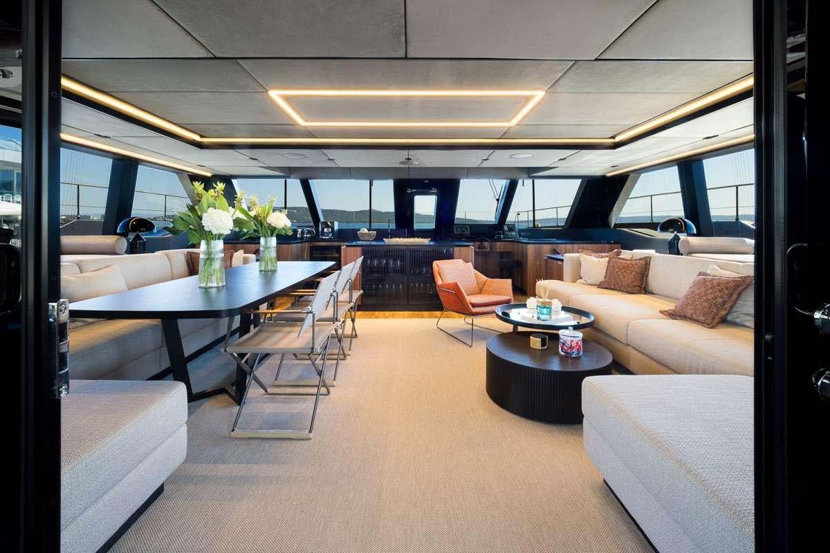 a room with a table and chairs aboard AMBER ONE Yacht for Charter