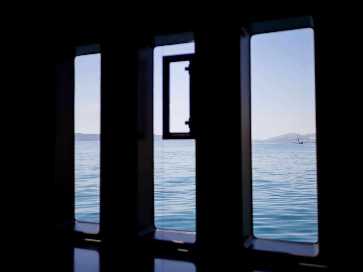 a window with a view of the ocean aboard AMBER ONE Yacht for Charter