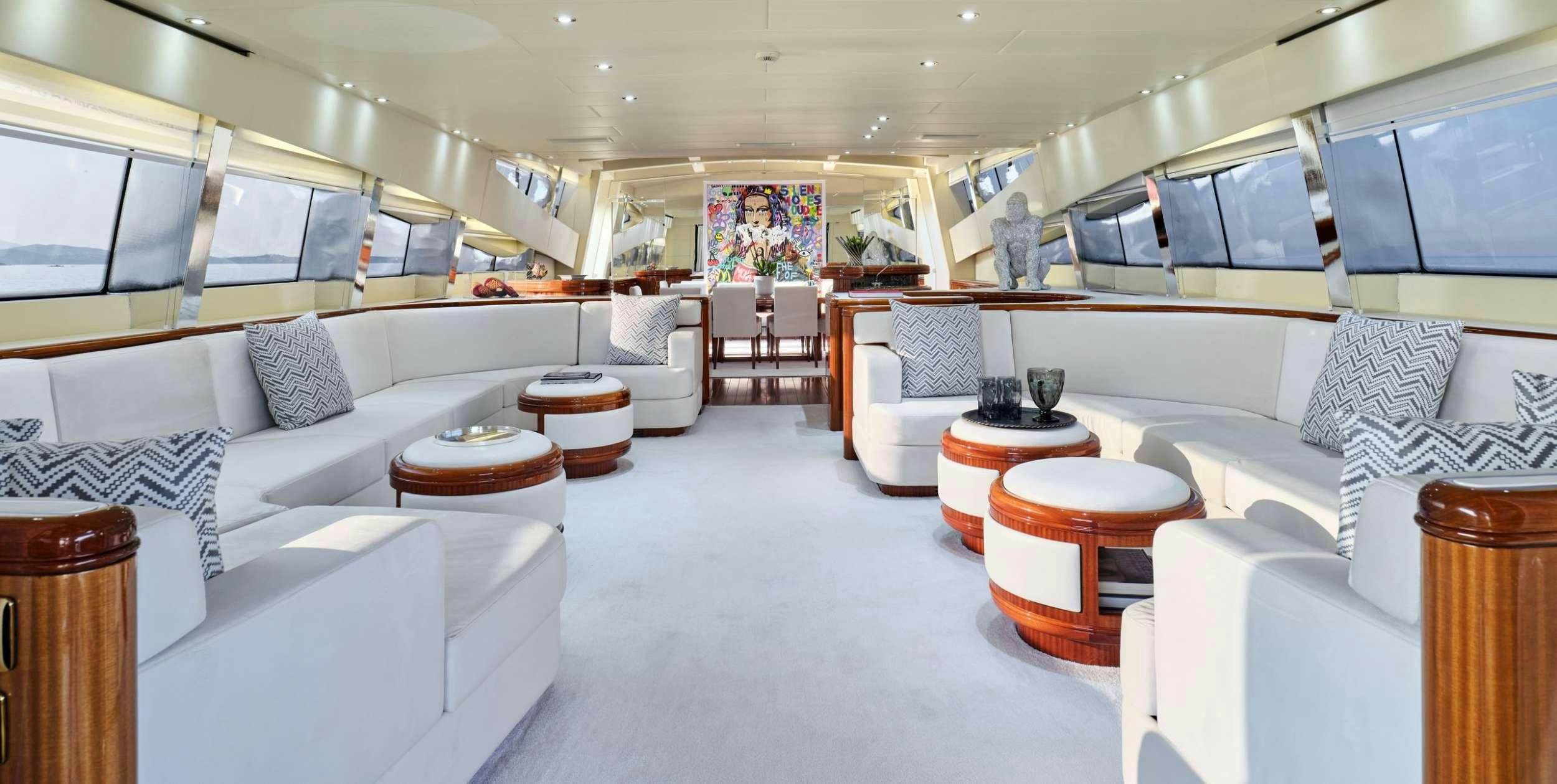 a room with a couch and a table aboard ABILITY Yacht for Charter
