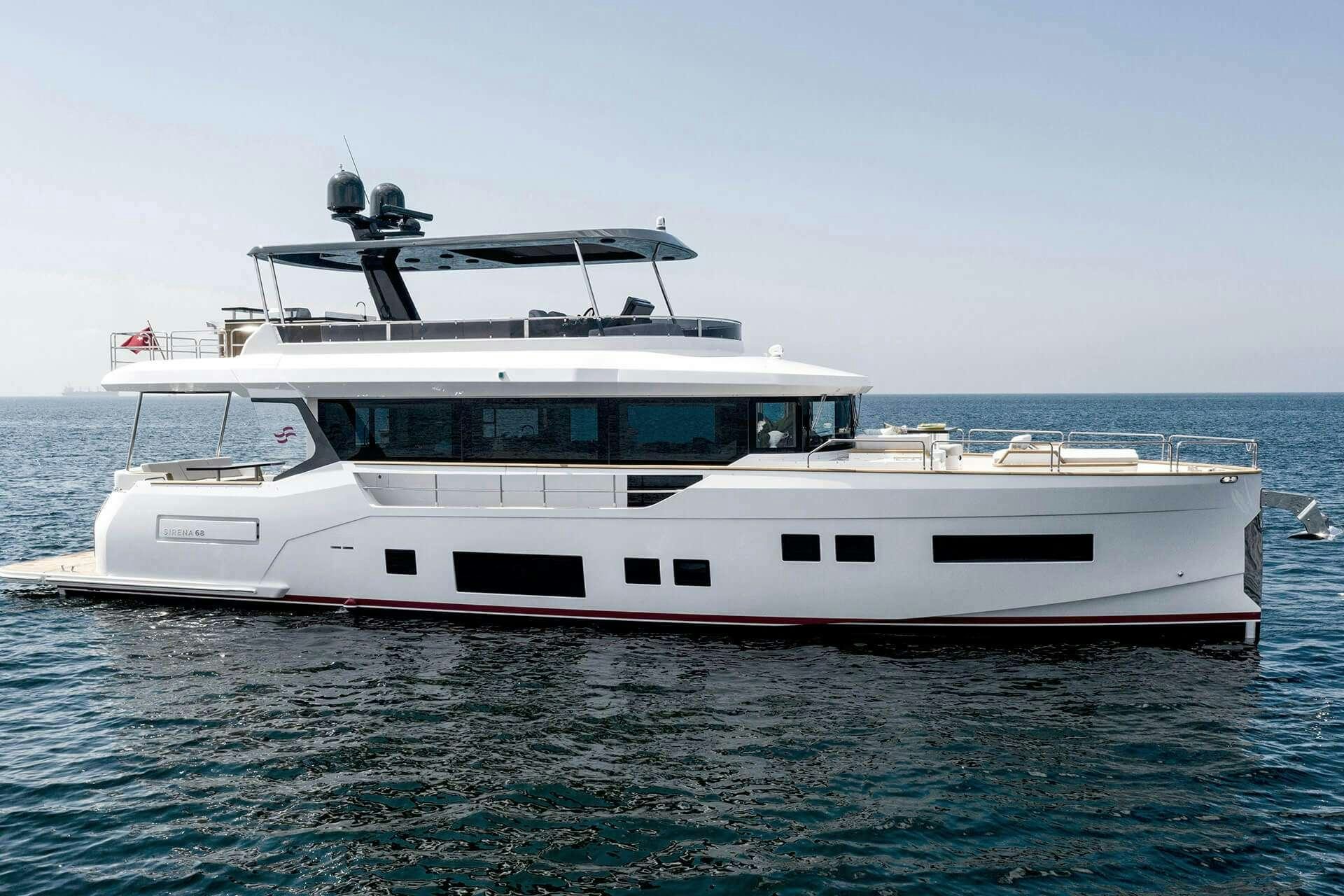 a white boat in the water aboard NORMAN'S T4 Yacht for Charter