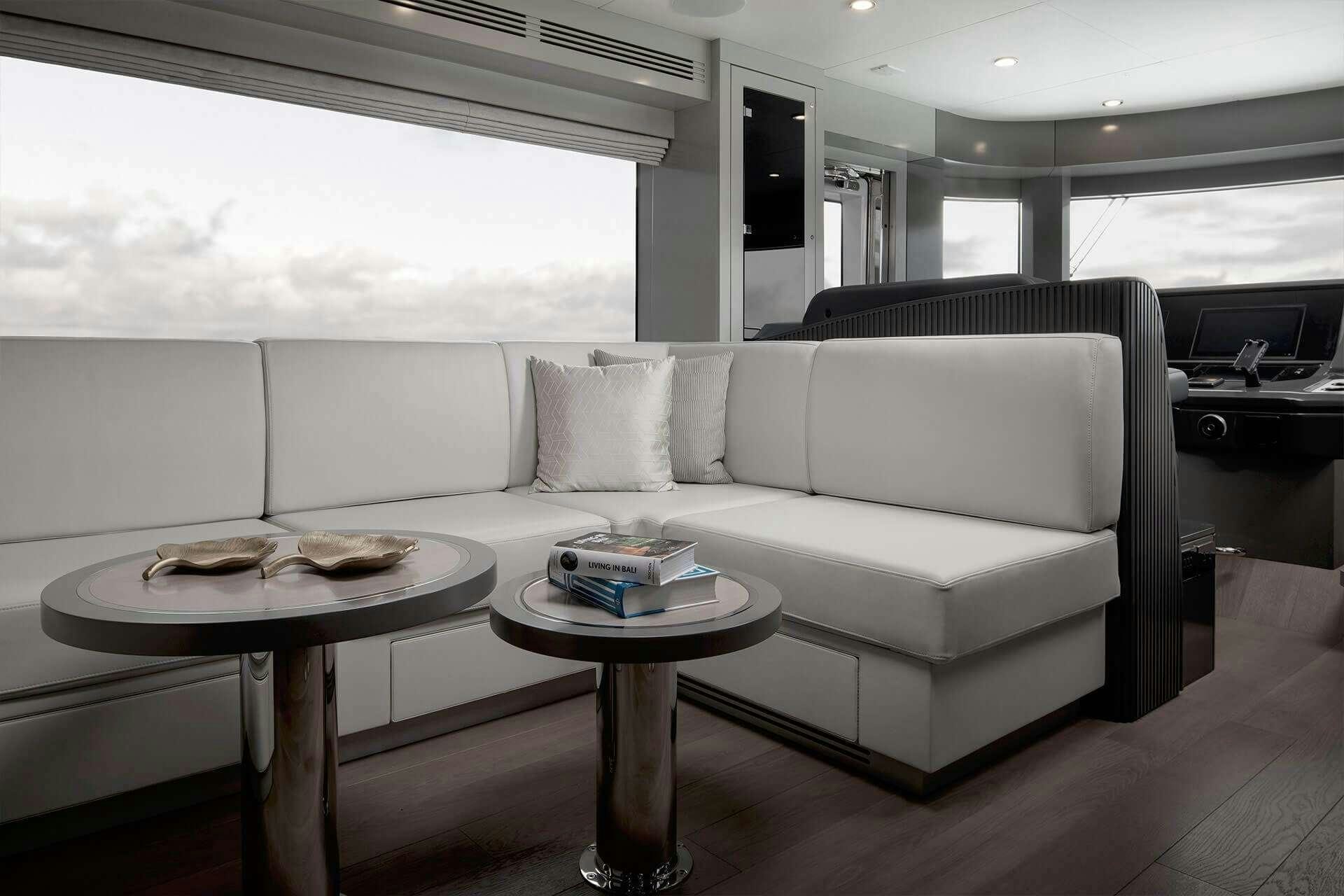 a white couch in a room aboard NORMAN'S T4 Yacht for Charter