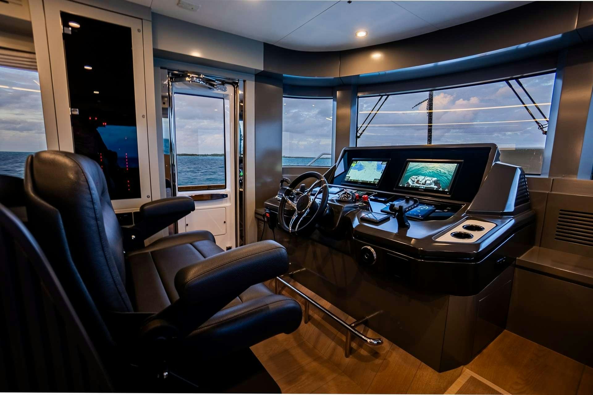 a room with a desk and computer aboard NORMAN'S T4 Yacht for Charter