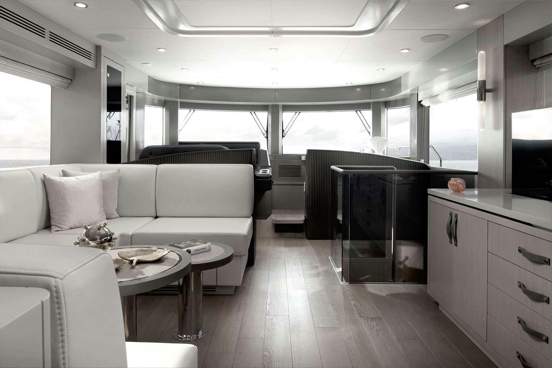a living room with a couch and a table aboard NORMAN'S T4 Yacht for Charter