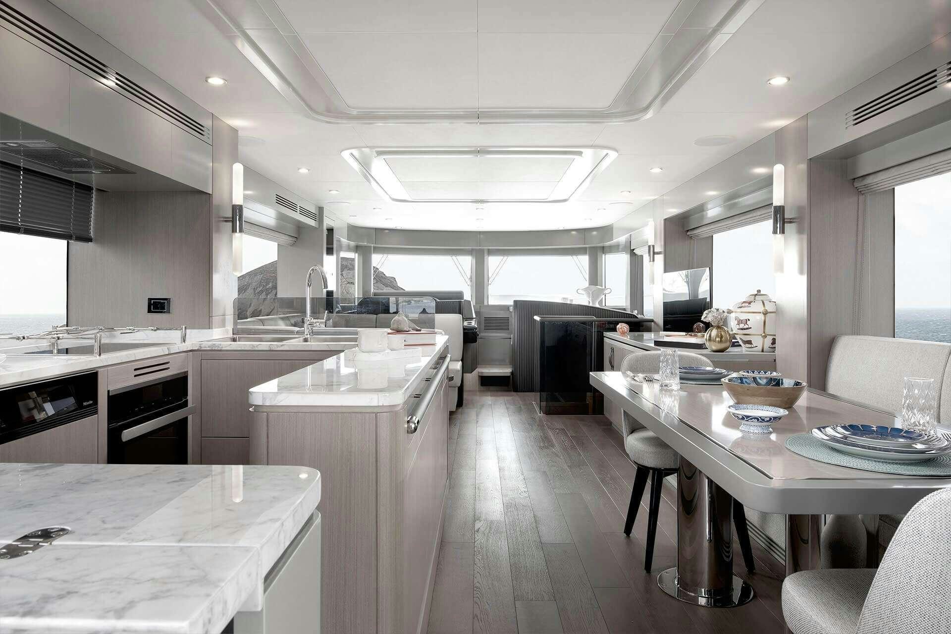 a large kitchen with white cabinets aboard NORMAN'S T4 Yacht for Charter