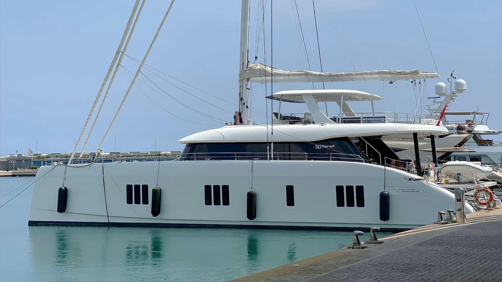 a white yacht docked aboard NALA ONE Yacht for Charter