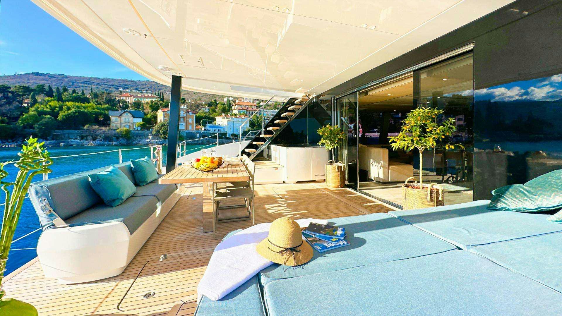 a large patio with a large pool aboard NALA ONE Yacht for Charter