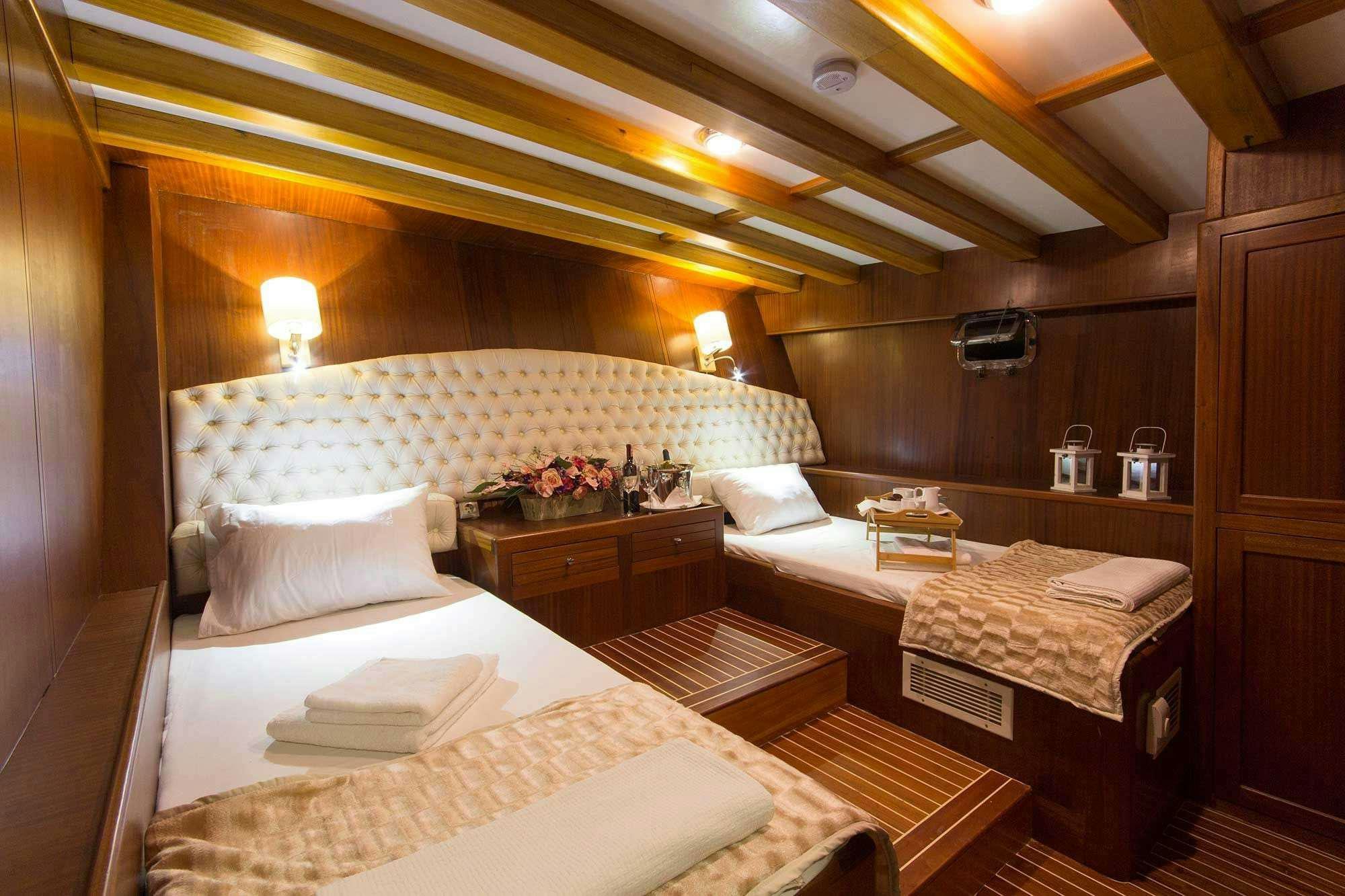 a room with two beds aboard BOREAS Yacht for Charter