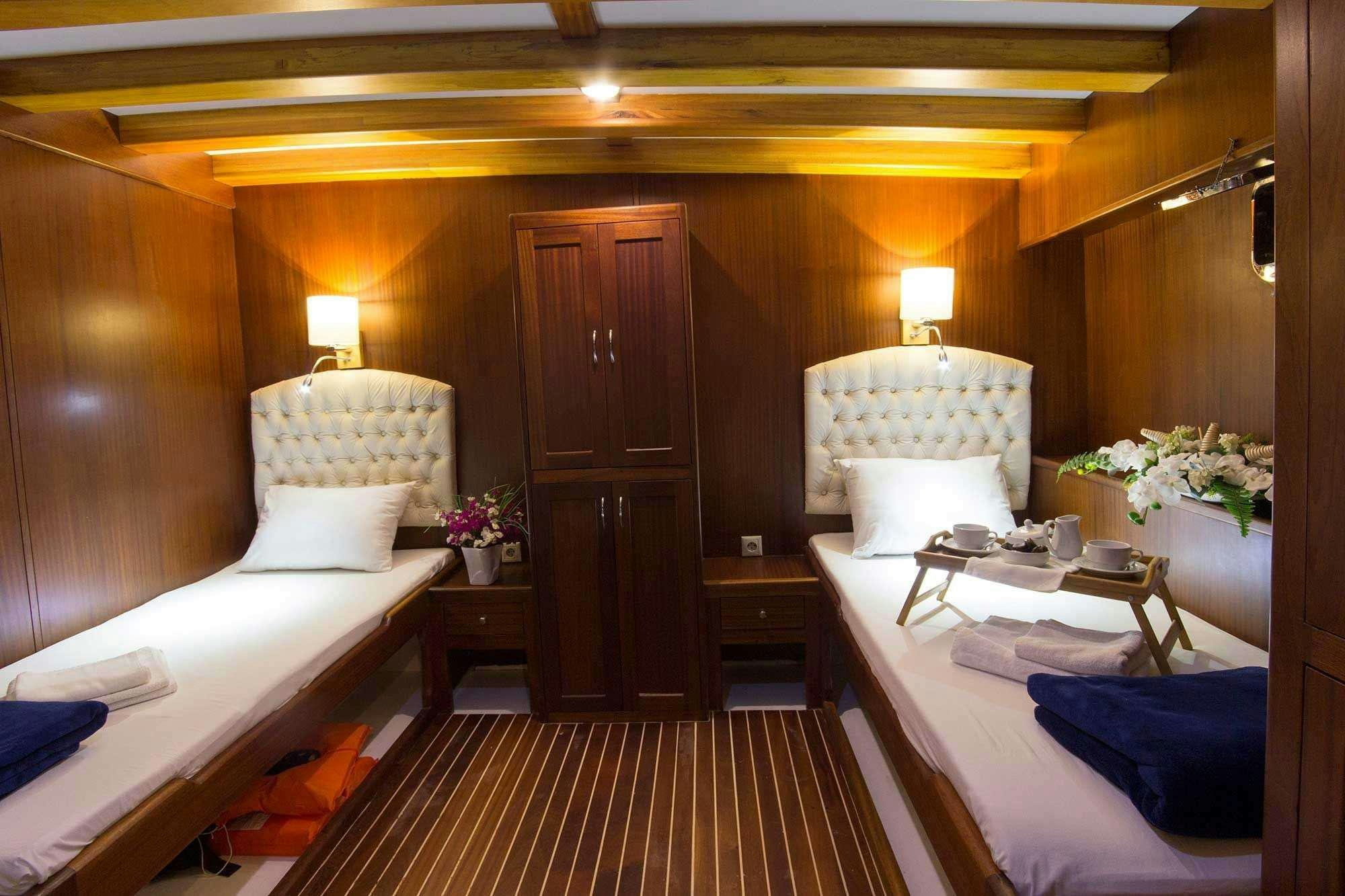 a room with a bed and a door aboard BOREAS Yacht for Charter