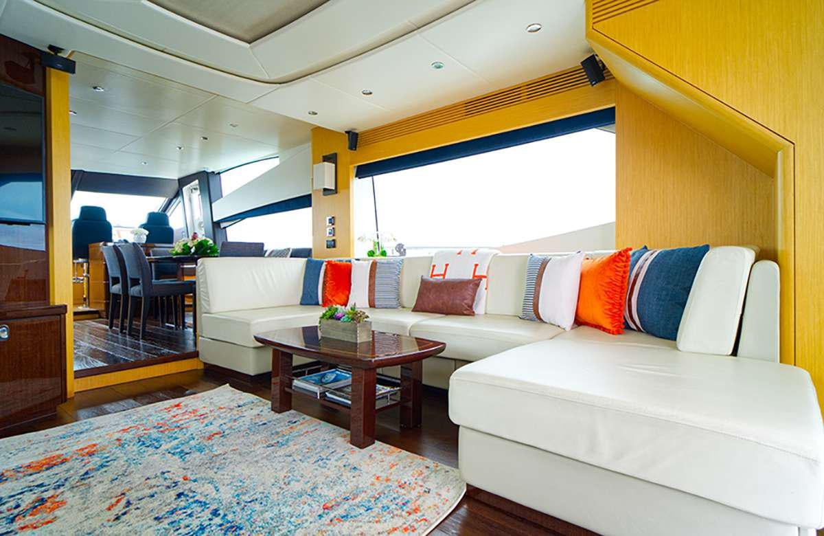 a living room with a couch and a table aboard DADDY'S $ Yacht for Charter