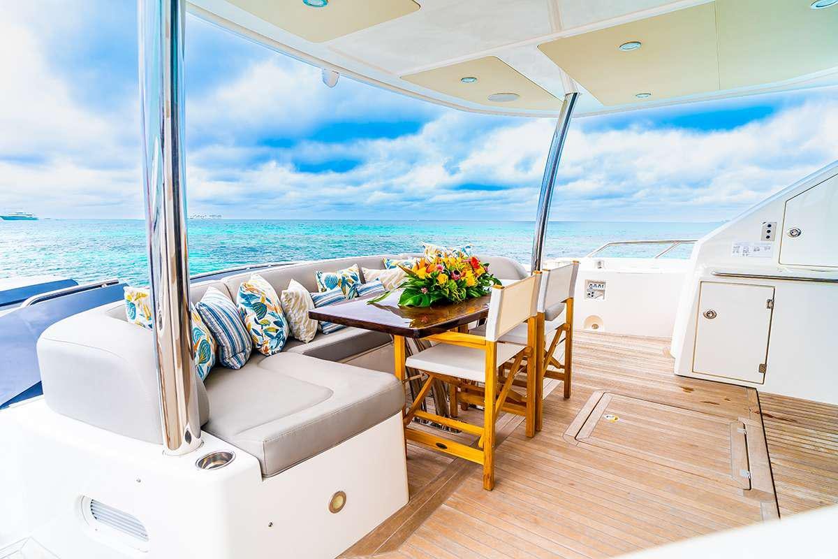 a room with a table and chairs aboard DADDY'S $ Yacht for Charter