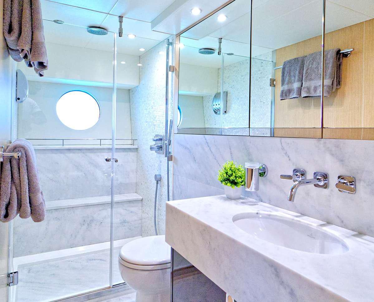 a bathroom with a glass shower aboard DADDY'S $ Yacht for Charter