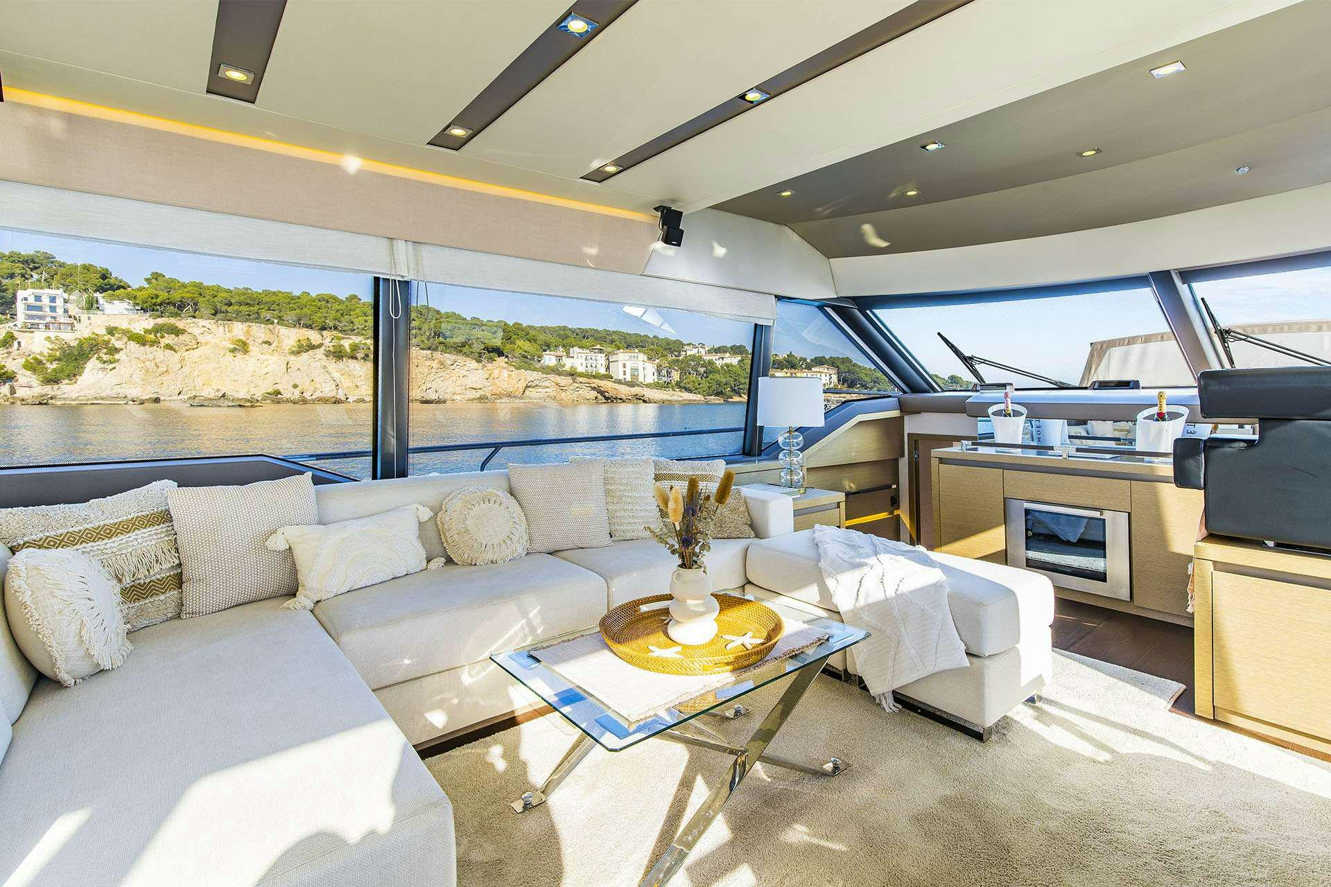 a living room with a large window aboard BLUE M Yacht for Charter