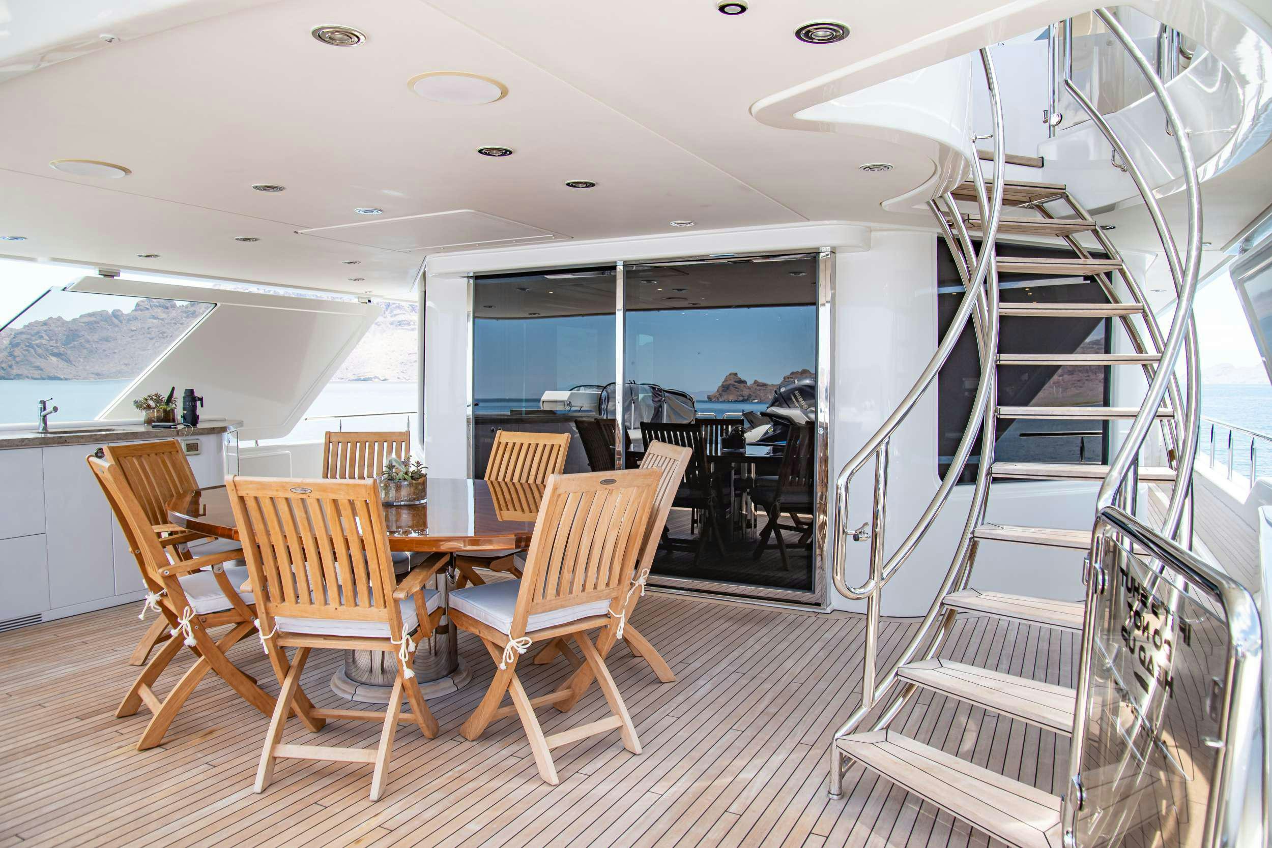 a dining room with a table and chairs aboard RULE NO. 1 Yacht for Charter