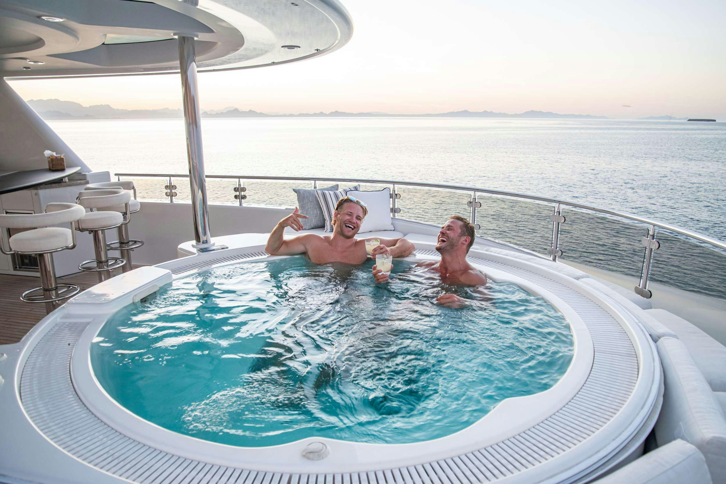 a couple of people in a pool aboard RULE NO. 1 Yacht for Charter