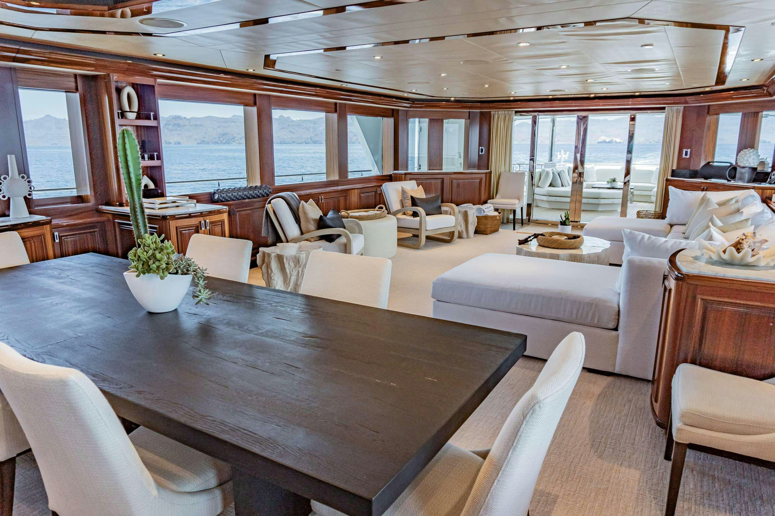 a large room with tables and chairs aboard RULE NO. 1 Yacht for Charter