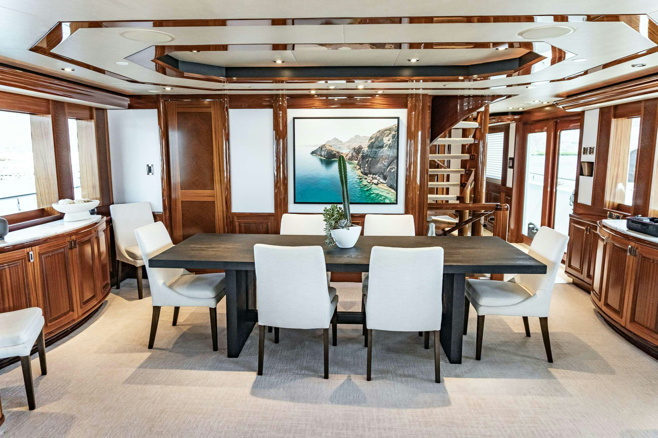 a large kitchen with a table and chairs aboard RULE NO. 1 Yacht for Charter