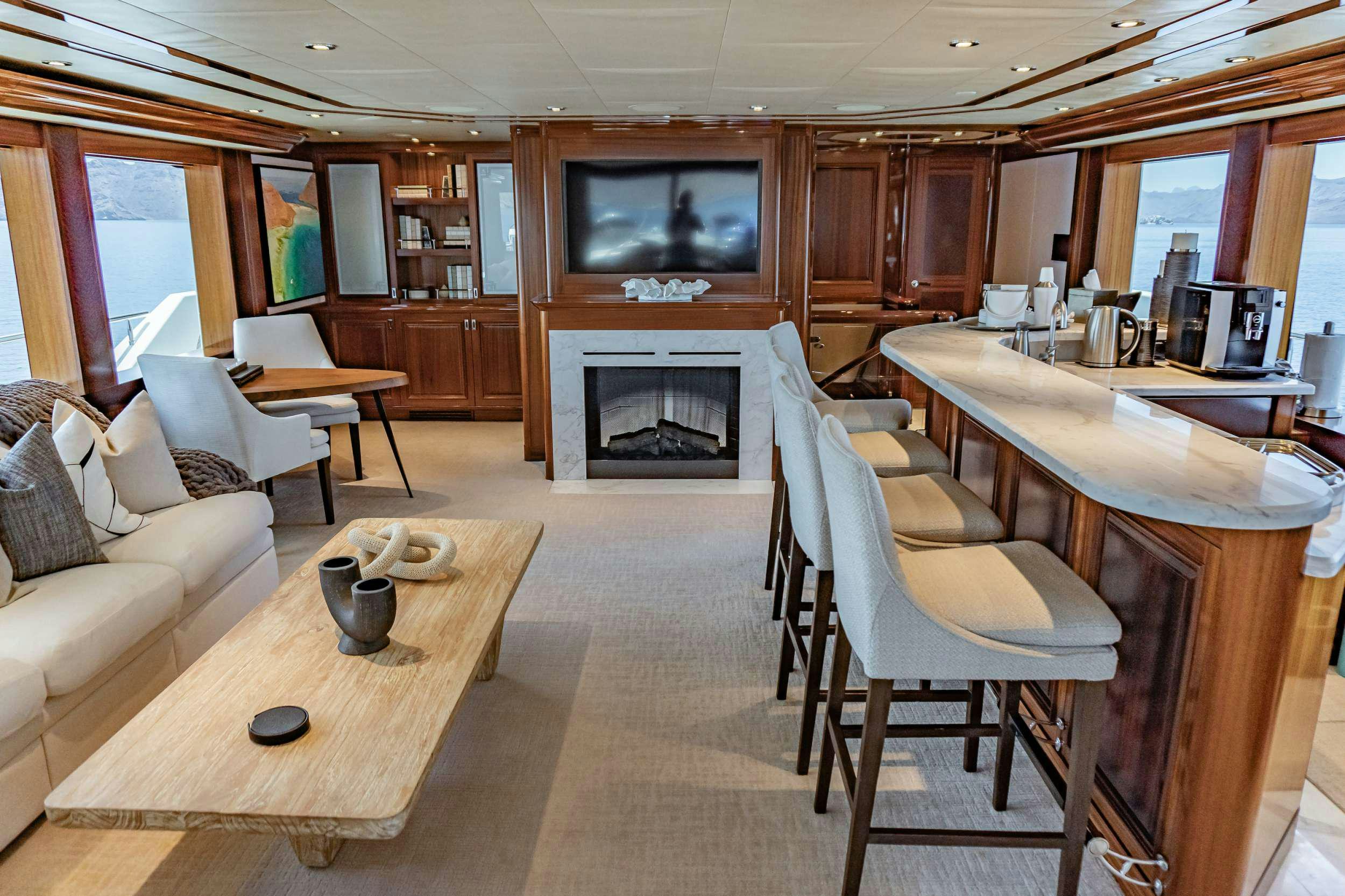 a living room with a fireplace aboard RULE NO. 1 Yacht for Charter