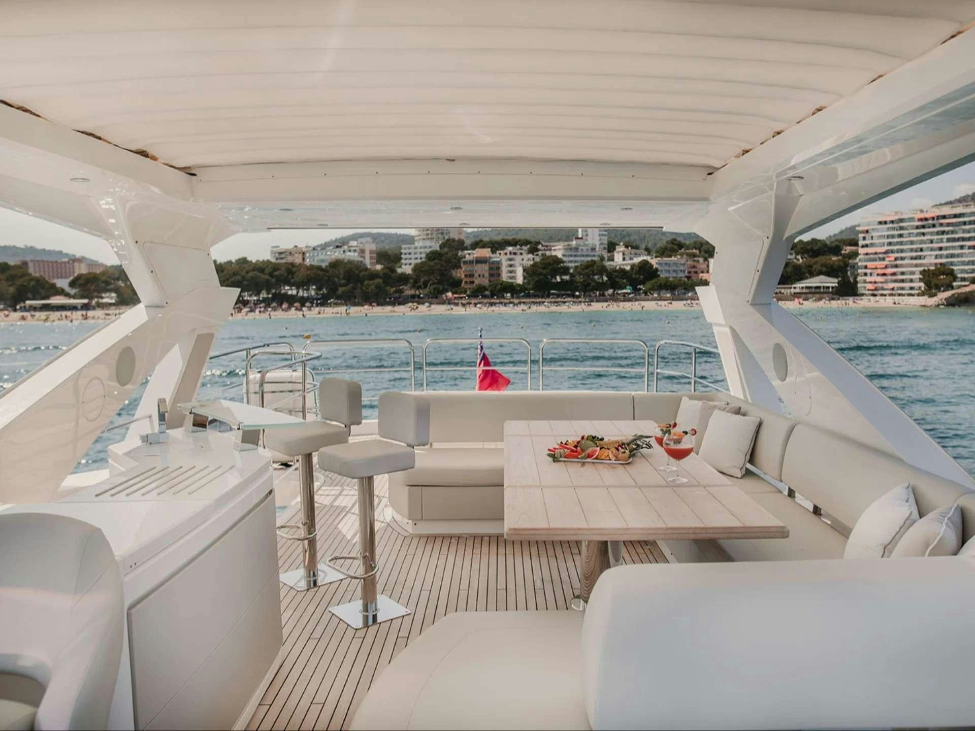 a deck with a view of a city and water aboard LADY M Yacht for Charter