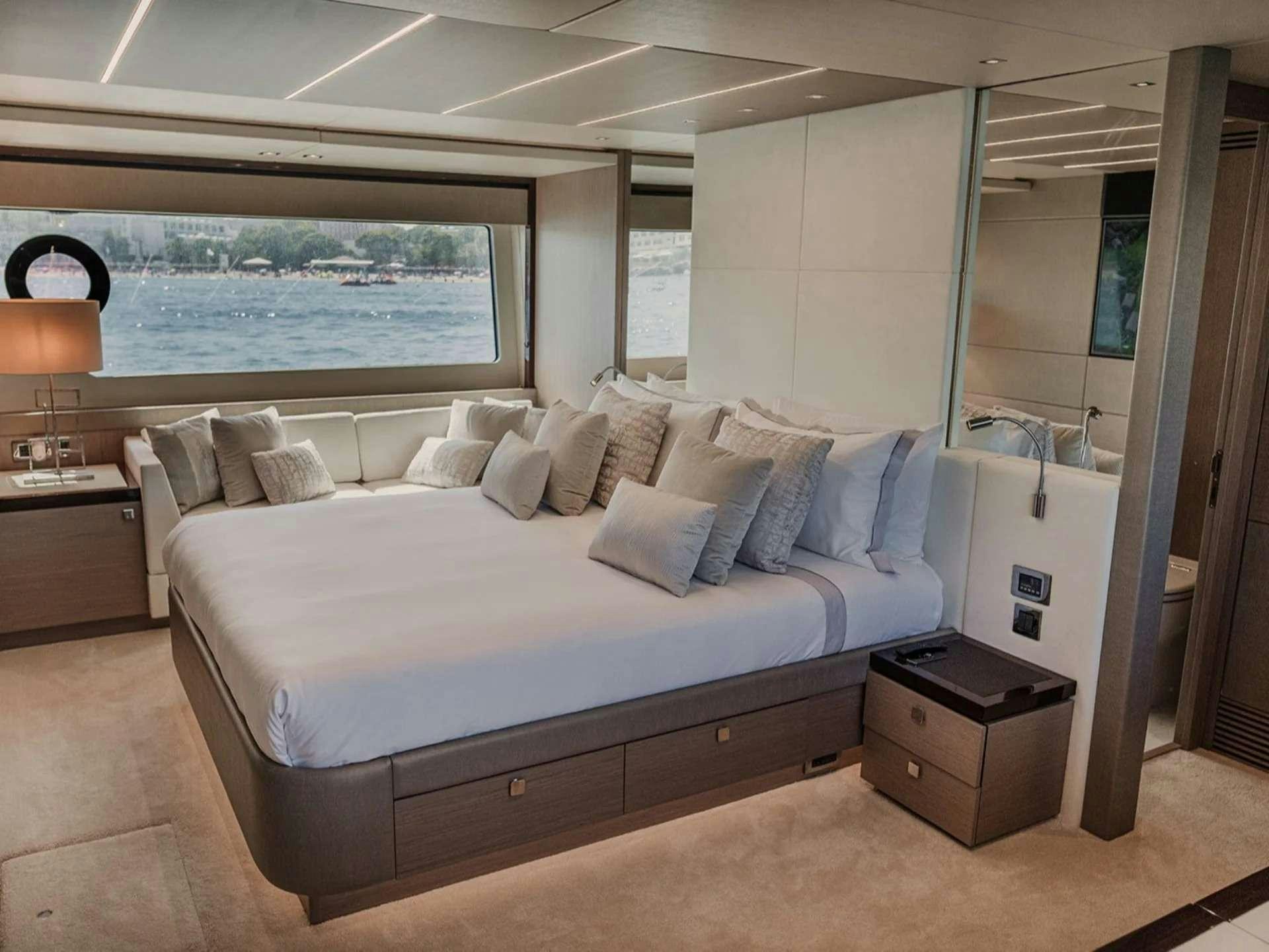 a bed in a room aboard LADY M Yacht for Charter