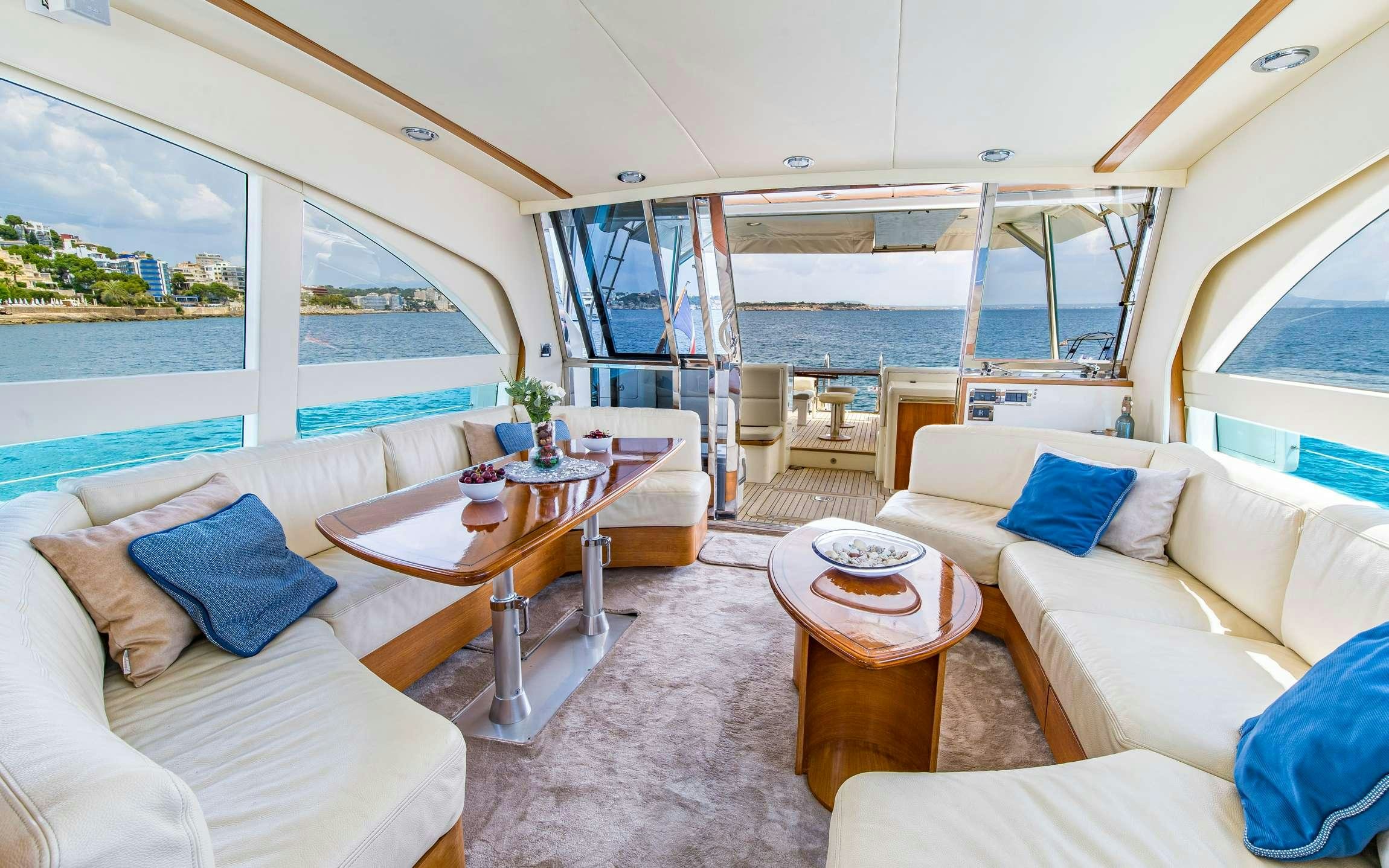 a living room with a large window aboard PARODIA Yacht for Charter