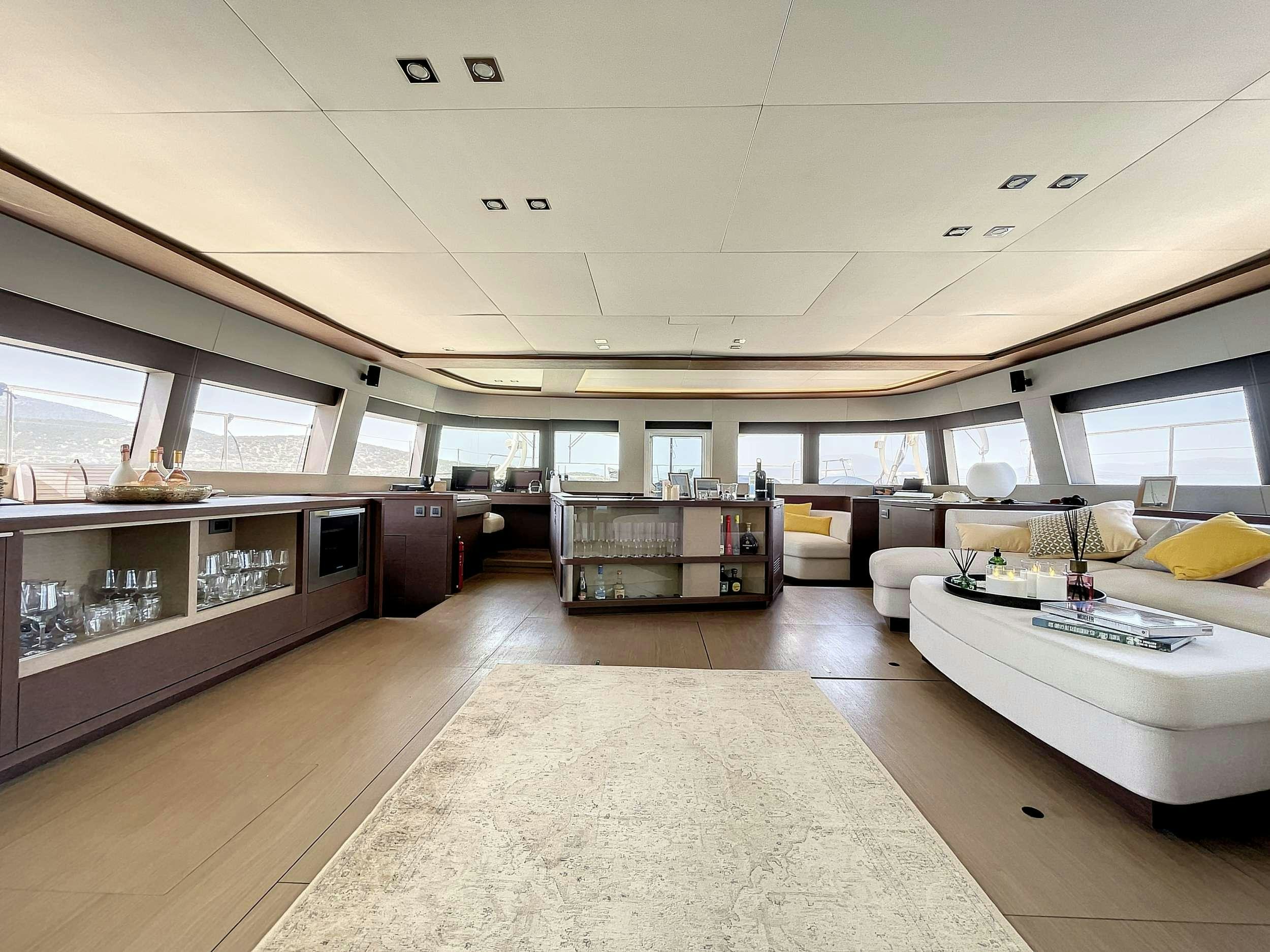 a room with a couch and a table aboard CRAZY HORSE Yacht for Charter