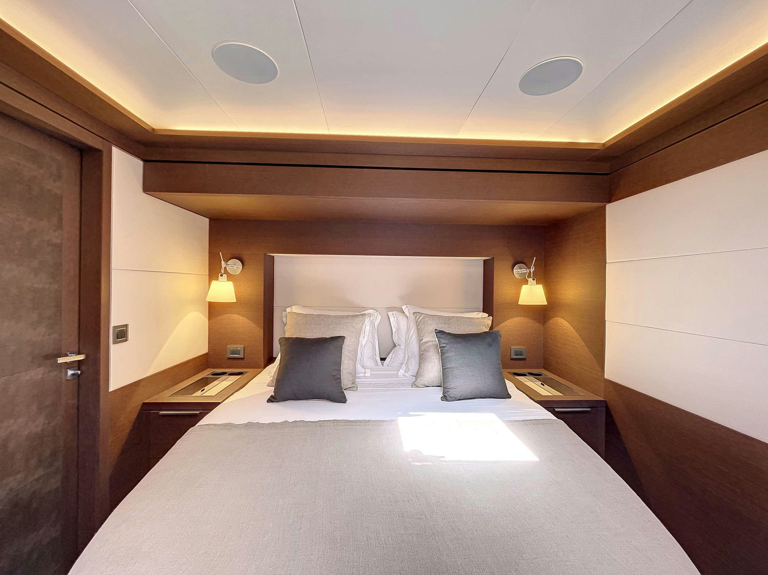 a bed with pillows and pillows aboard CRAZY HORSE Yacht for Charter