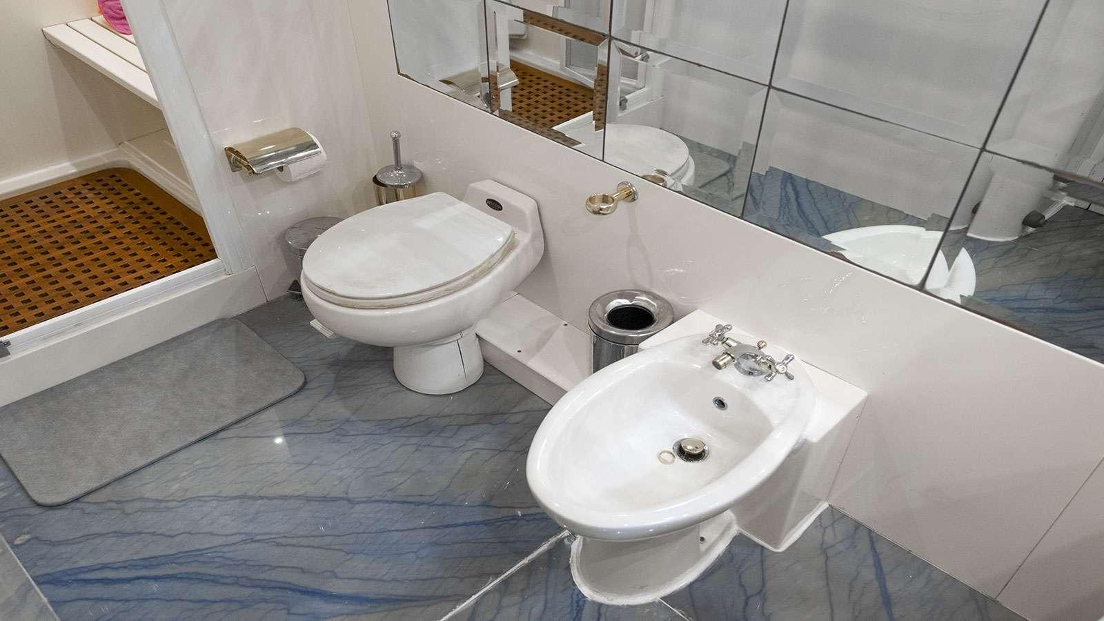 a bathroom with a sink and a toilet aboard TITAN Yacht for Charter