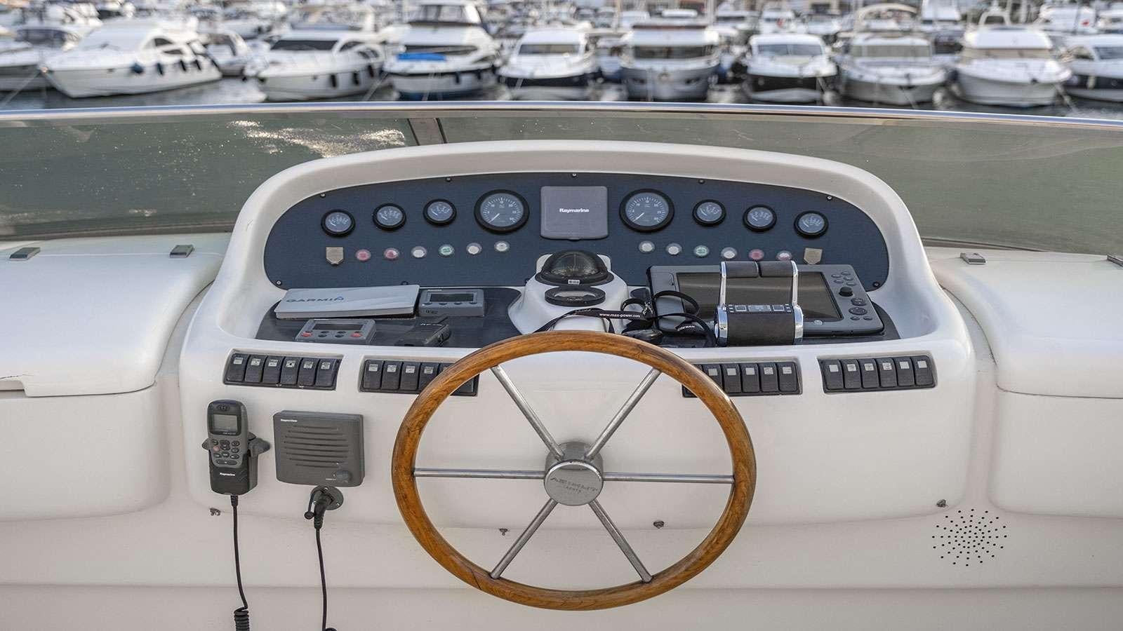 a video game console on a table aboard TITAN Yacht for Charter