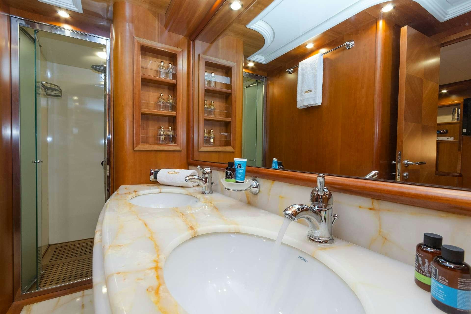 a bathroom with a large mirror aboard ALFEA Yacht for Charter