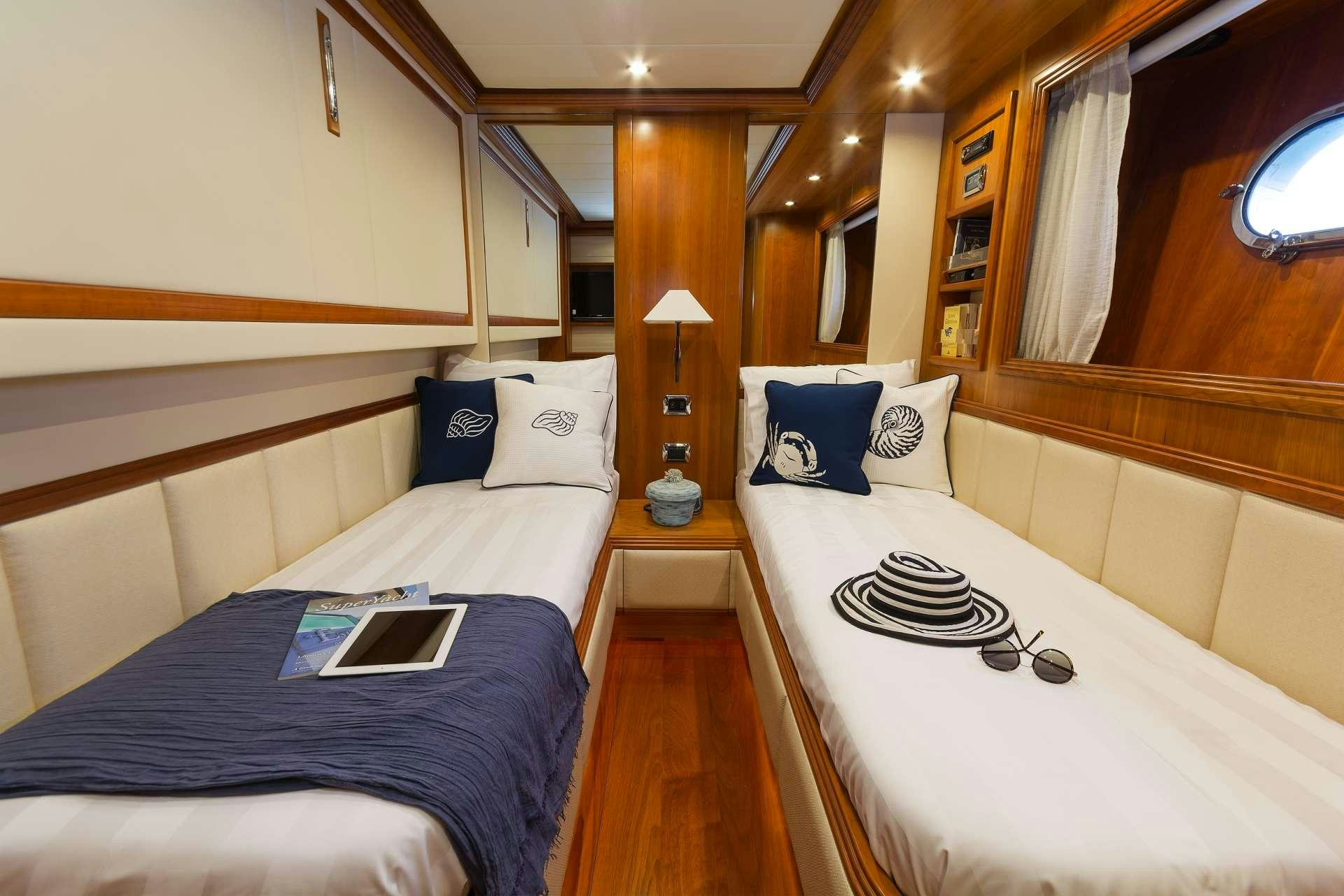 a room with two beds aboard ALFEA Yacht for Charter