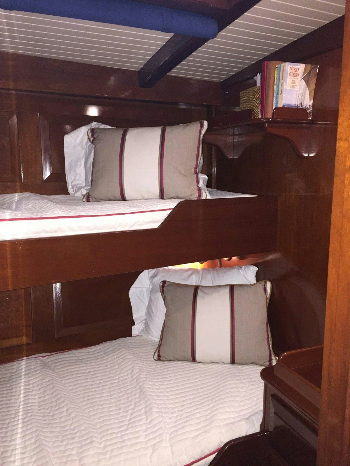 a bed with pillows aboard NORTHERN STAR Yacht for Charter