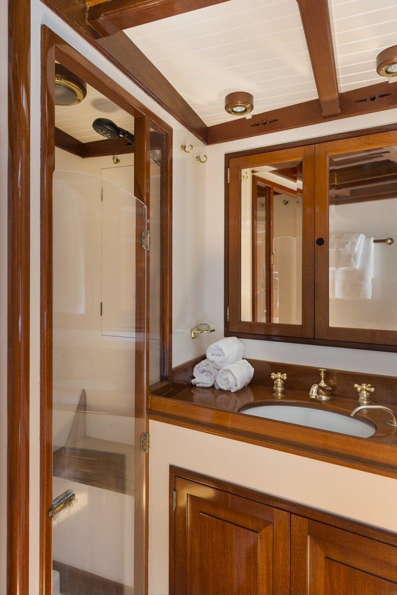 a bathroom with a sink and a shower aboard NORTHERN STAR Yacht for Charter