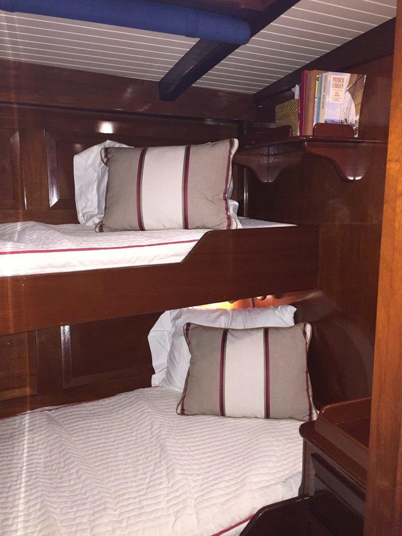 a bed with pillows aboard NORTHERN STAR Yacht for Charter