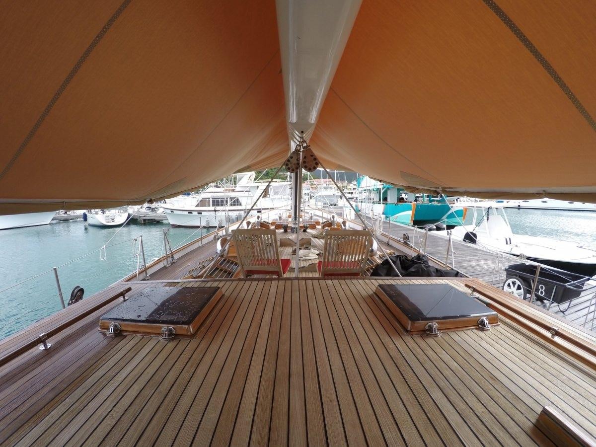 a deck with a large umbrella aboard NORTHERN STAR Yacht for Charter