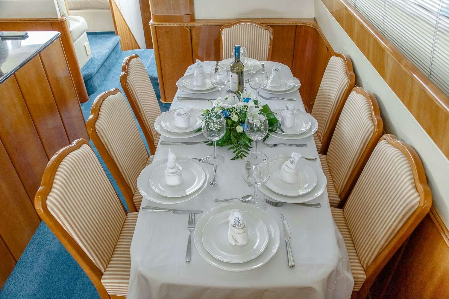 a table set for a dinner aboard GODSPEED Yacht for Charter