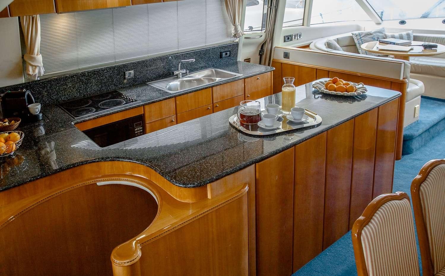 a kitchen with a countertop aboard GODSPEED Yacht for Charter
